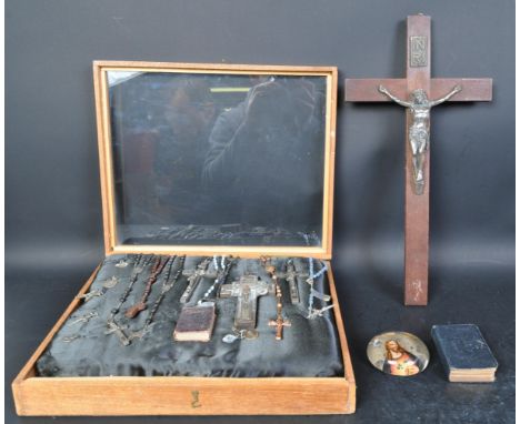 A collection of 19th century &amp; later religious rosary crucifix in wooden glazed plinth display cabinet, a miniature leath