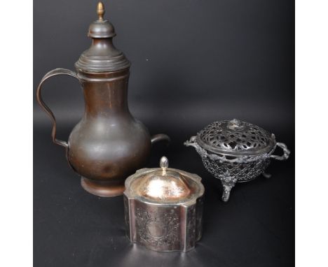 An early 20th century Persian copper dallah coffee pot together with a vintage white metal tea caddy and a silver plated pier