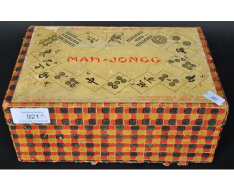 A vintage 20th Century Mah - Jongg Chinese oriental board game. Published by Chad Valley, Harborne, England. With lid and fiv