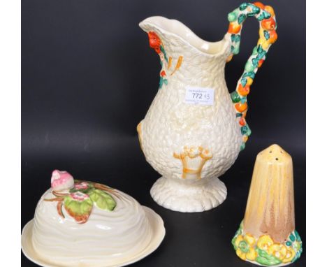 An assortment of mid 20th century Clarice Cliff pottery items comprising of a 'Celtic Harvest' water jug, a 'My Garden' patte