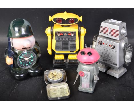 An assortment of retro vintage mid 20th Century Robot radios. Including Star Command i-m-i starriod in a grey colourway, i-r-