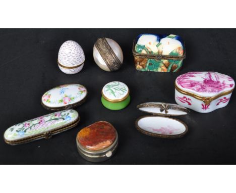 An assortment of nine 19th century &amp; later porcelain and enamel pill boxes to include makers such as a hand painted magen
