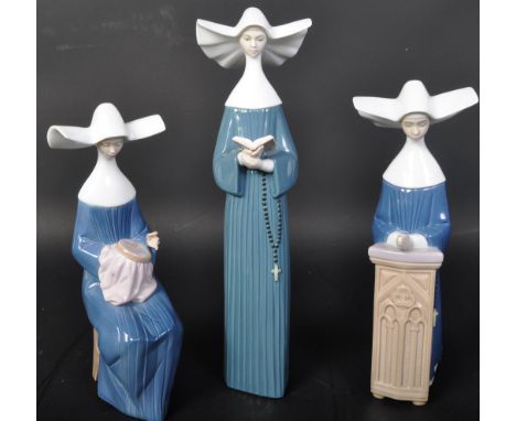 A group of three vintage 20th Century circa 1980s Lladro hand made Spanish ceramic Nun figurines. Serial numbers and producti