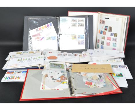 A collection of British UK first day covers and stamp albums. Over four stamp albums some frank and unfranked British and for