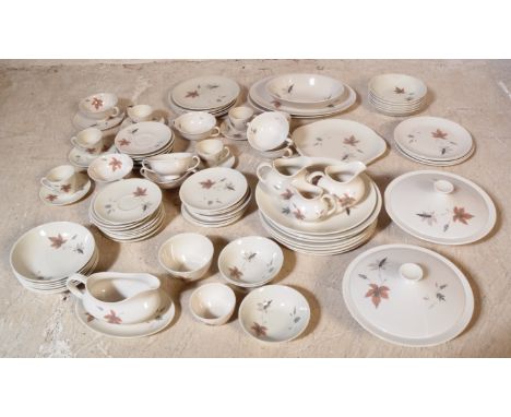 An extensive vintage 20th century Royal Doulton bone china tea and dinner service in the Tumbling Leaves pattern. The service