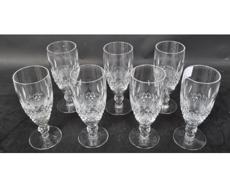 A set of six vintage 20th century Waterford Crystal 'Lismore' pilsner / short stemmed flute cut glass drinking glasses. Each 