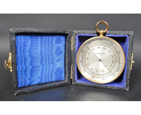 An early 20th Century cased GPO compensated pocket barometer, complete in presentation case. Gilt metal casing with silvered 