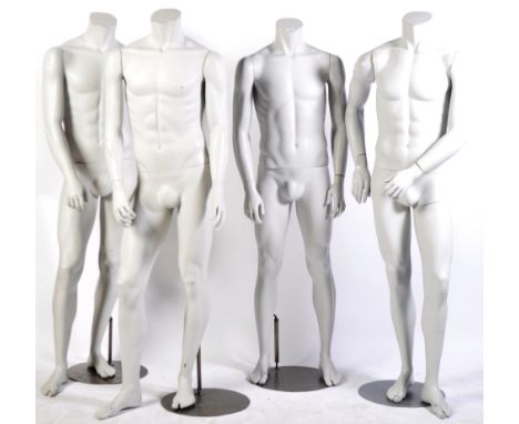 A set of five contemporary advertising point of sale shop display haberdashery male mannequins with one female example. Each 