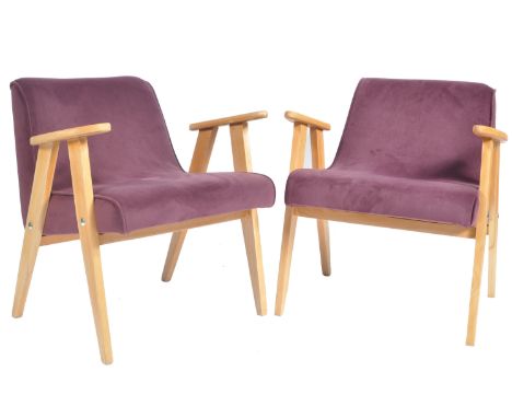 A matching pair of retro vintage 20th Century 1960's light oak framed easy lounge armchairs / office chairs having decorative