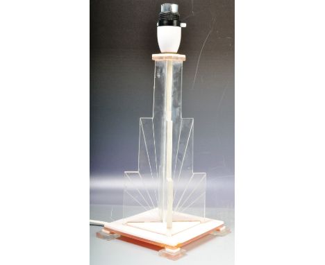A vintage early 20th Century Art Deco lucite table lamp of American influence having a two piece stepped interlocking rising 
