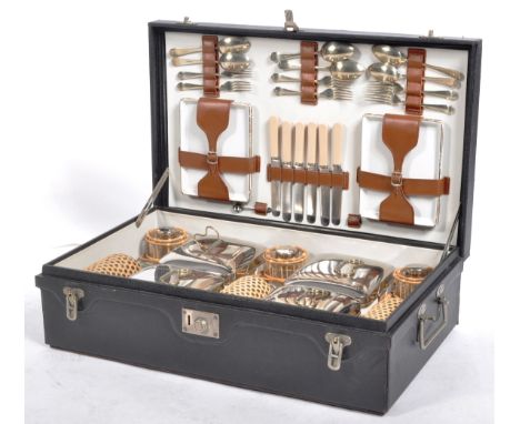 A scarce original early 1900s classic car touring picnic hamper. The hamper complete with all items, including the silver pla