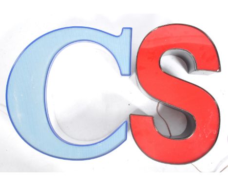 Two vintage late 20th Century retro style&nbsp;advertising point of sale light box letters 'S' and 'C'. The 'S' being dark br