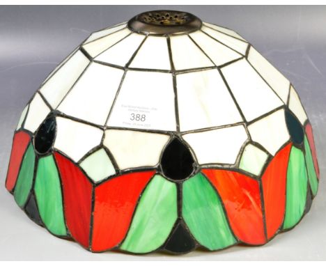 A vintage 20th Century Tiffany style leaded glass hanging ceiling light shade / lamp shade of bowl form having a series colou