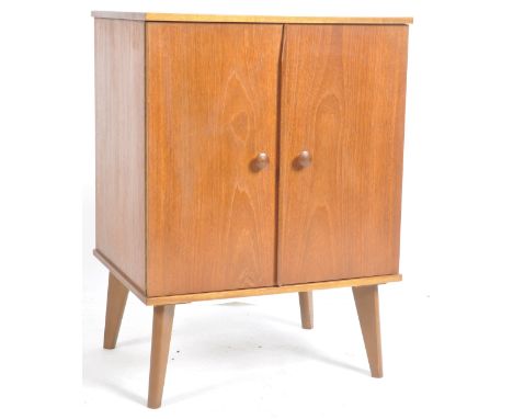 Arnold - A retro vintage 20th Century teak wood record / Hi-Fi music cabinet of pedestal form having twin doors with central 