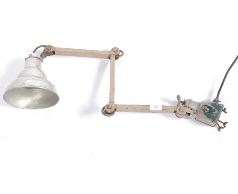 A retro vintage mid 20th Century 1950's industrial factory work machinist lamp having a brushed metal Photax shade raised on 