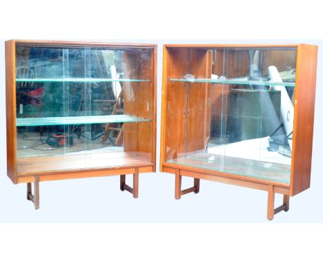 Turnidge Of London - A matching pair of retro vintage 20th Century British design teak wood bookcase / display cabinets. Each