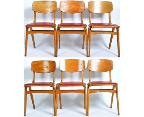 A set of six retro mid 20th Century Post War German made vintage beech wood / ply stacking dining chairs / side chairs having