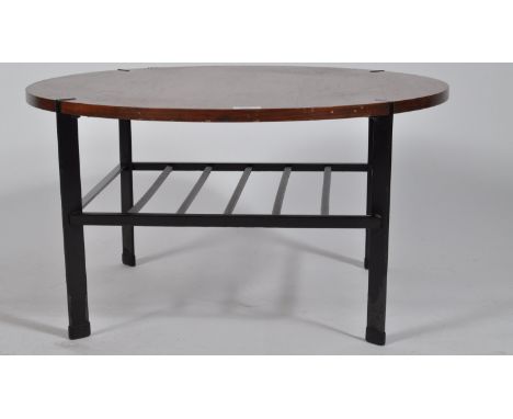 A retro vintage 20th Century British design coffee table / centre occasional table having a teak wood circular top supported 