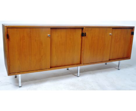 Florence Knoll - A retro vintage 20th Century American designer teak wood sideboard credenza having four sliding doors with l