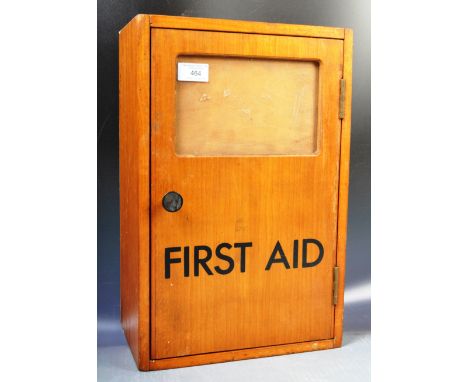 An original retro vintage mid 20th Century industrial First Aid Box / cabinet. The kit of wooden construction with bold black