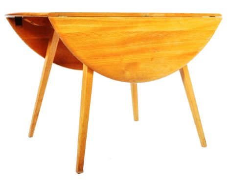 Lucian Ercolani - Ercol - Windsor 384 - A retro vintage 1960's beech and elm round circular drop leaf dining table having a c