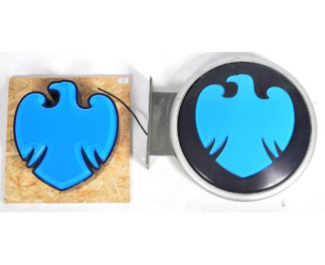 Barclays Bank - Two contemporary advertising point of sale light boxes with one in the form of iconic eagle logo having dark 