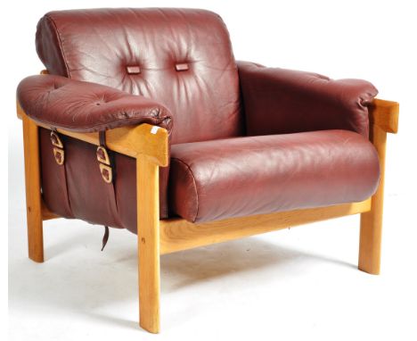 Manner of Percival Lafer - A retro vintage 1960's Scandinavian leather armchair / lounge chair or easy chair having a good gr