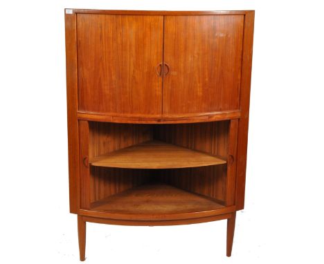 A superb retro vintage mid 20th Century 1970's Danish teak cocktail drinks corner cabinet having a two tambour fronted sectio