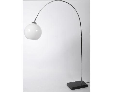 A retro vintage Italian style floor standing arc lamp light having a milk glass globular shade with adjustable chrome arm rai