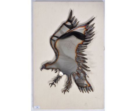 A retro vintage 20th Century Brutalist metal folk art panel / mirror sculpture in the form of an eagle in flights. Burnished 