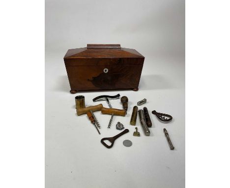 An early Victorian rosewood sarcophagus tea caddy, with two internal lidded compartments and sold with a group of corkscrews 