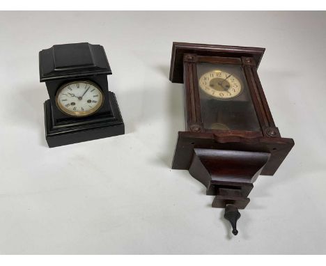 A slate mantel clock and a wall clock