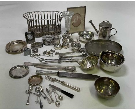 A large collection of silver, white metal and silver plate including a ladle with scallop moulded bowl, pair of cruets, vario