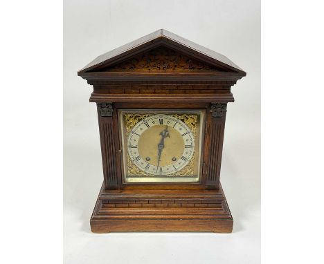WINTERHALDER &amp; HOFMEIER; an early 20th century oak cased mantel clock, with architectural columns flanking the brass dial
