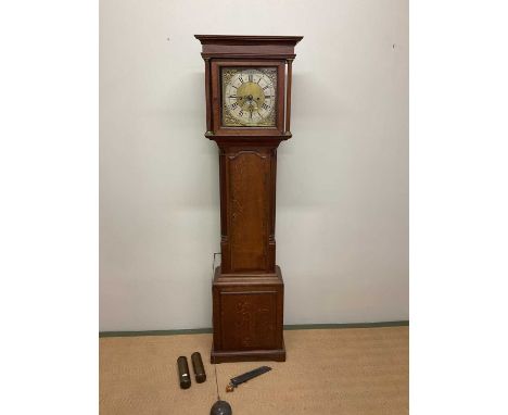 An early 19th century oak and mahogany crossbanded eight day longcase clock, the brass dial set with silvered chapter ring in