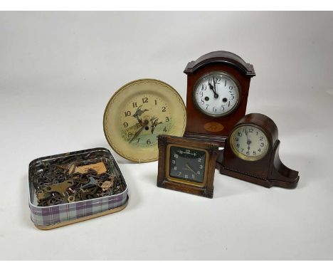 A collection of clocks including a Smiths flying ducks tin plate wall clock, a Smiths wooden framed alarm clock and two mante