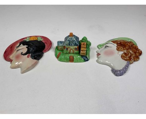 Two similar Art Deco inspired wall plaques inscribed 'C &amp; C England', height approx 19cm, also a novelty cruet stand in t