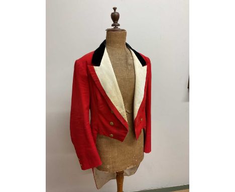 DEVON/EXMOOR HUNT; a vintage red evening tail coat with brass buttons monogrammed FBH. Chest measurement is approx 36" 