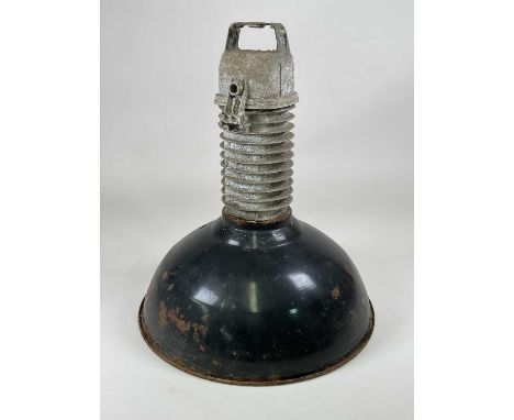 A large enamel industrial pendant light, with black enamel exterior and white interior, height 59cm, diameter 50cm.