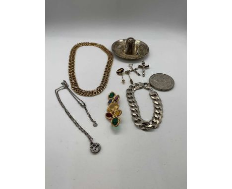 A small group of costume jewellery including two crucifix pendants, pendant on chain, brooch, bracelet, collar and a Mexican 