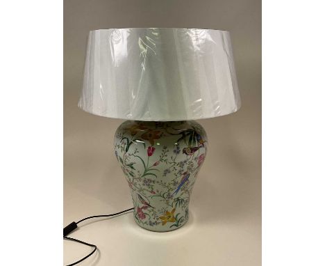 RAFFLES; a ceramic table lamp base with shade, decorated with exotic botanical flowers and birds, base height 48cm.