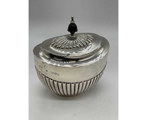 EDWARD HUTTON; a late Victorian hallmarked silver lidded sugar basin of oval form with part gadrooned detail to the base, Lon