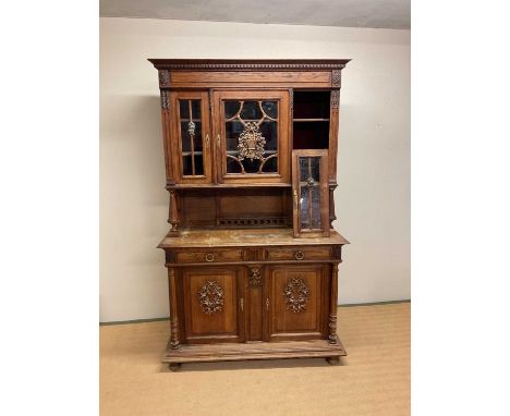 A French oak buffet comprising three sections with glazed top over two drawer base and cupboard (with key), height 224cm, wid