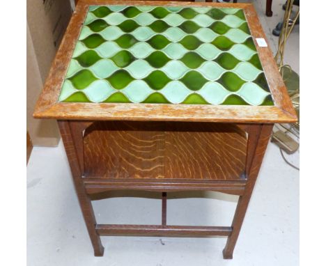 An Arts & Crafts oak 2-tier tile top occasional table