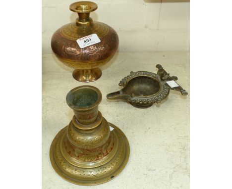 Three pieces of Indian metalware including a lota; an oil lamp; a hookah base