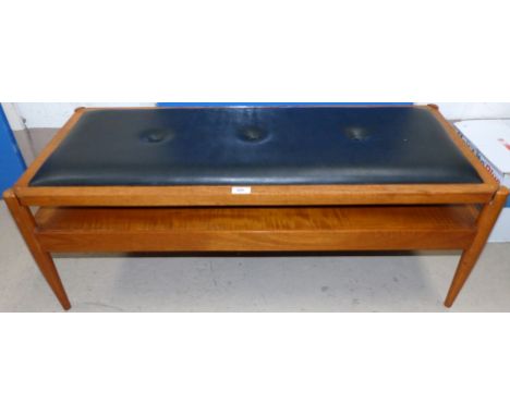 A 1970's teak 2 tier coffee table with reversible seat top, "Pleasing Furniture" by Pye-Franklin Ltd