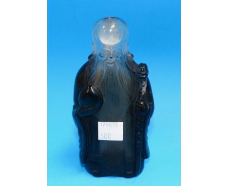 A Chinese glass/crystal snuff bottle in the form of a sage with stick and gourd, height 5"