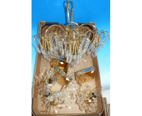 A similar chandelier and wall light set