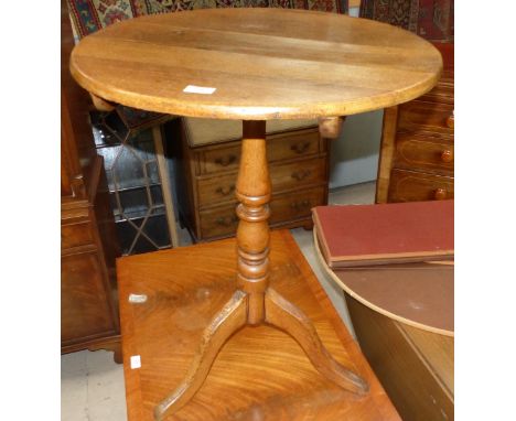 A 19th century oak circular occasional table on tripod base