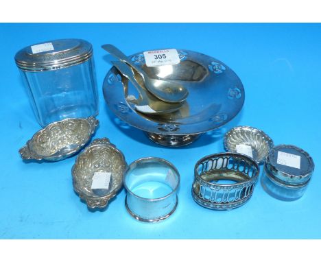 A pair of oval embossed bon-bon dishes, Chester 1900; a similar circular dish; a silver napkin ring; a pieced silver salt (no